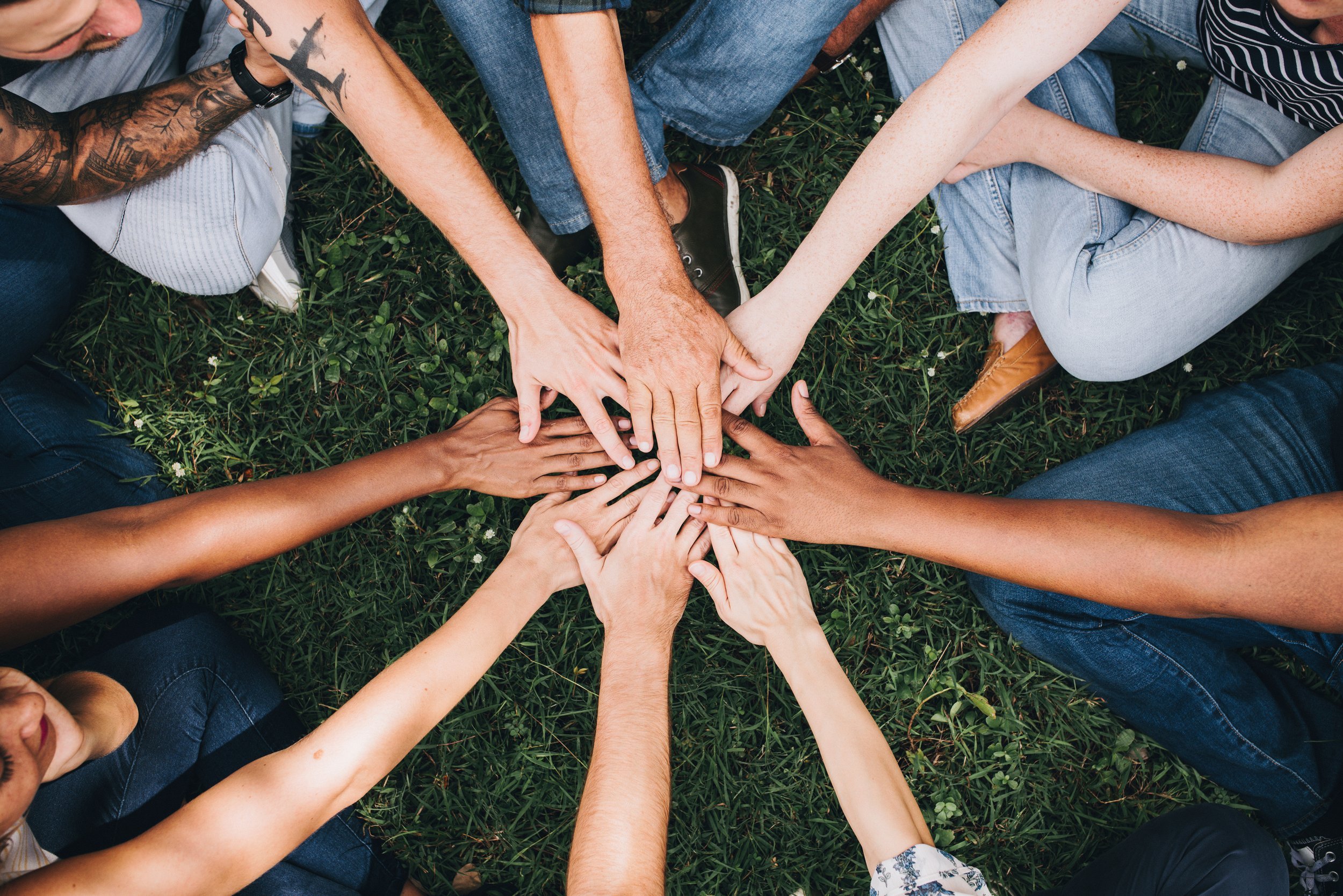 Hands coming together in a circle